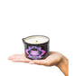 Kama Sutra Island Passionfruit Ignite Massage Candle product image with hand